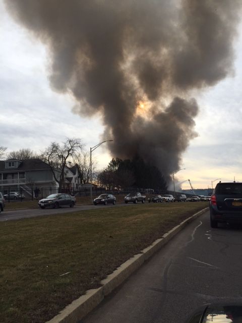 Smoke rises from roundhouse.